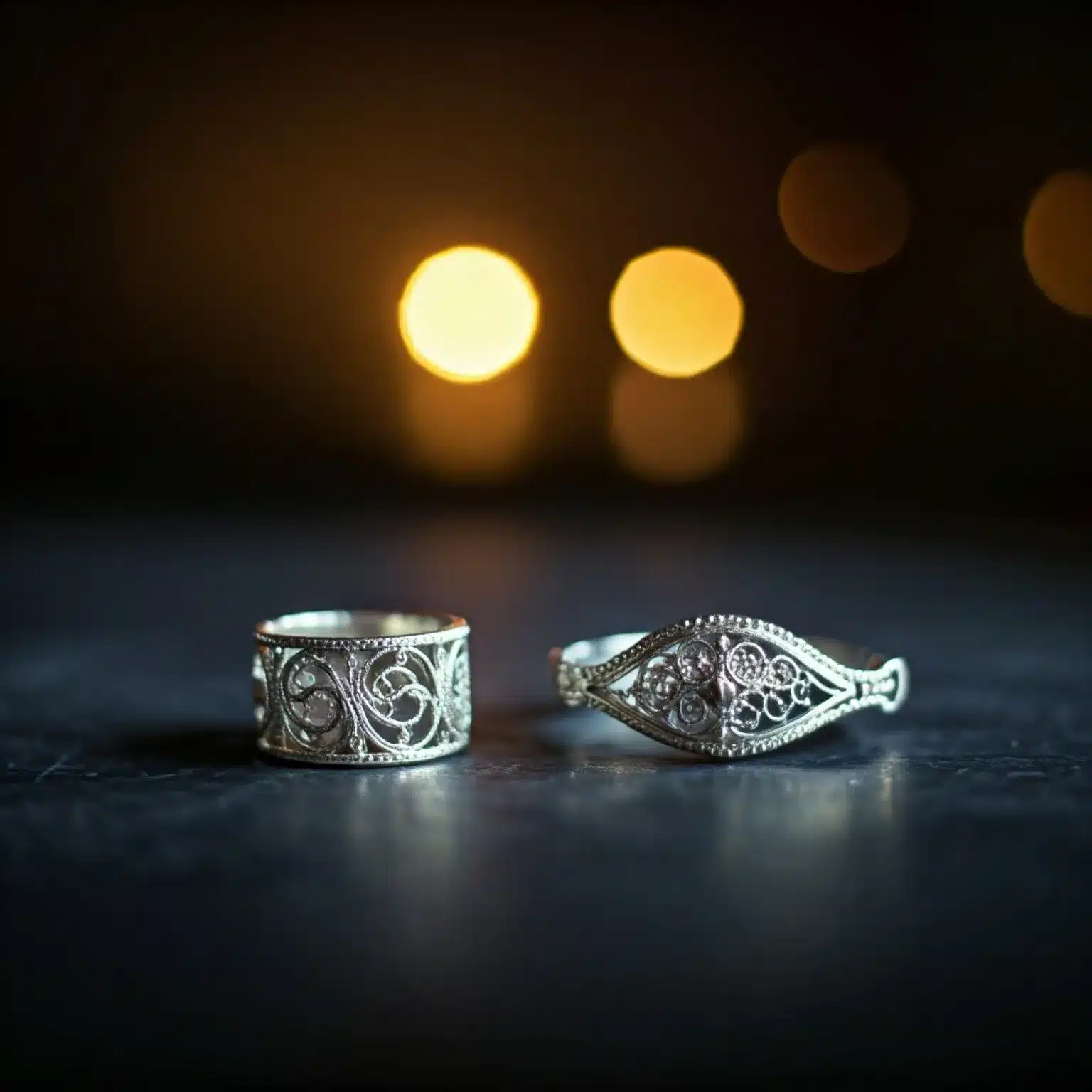 925 silver jewelry pieces on a dark surface