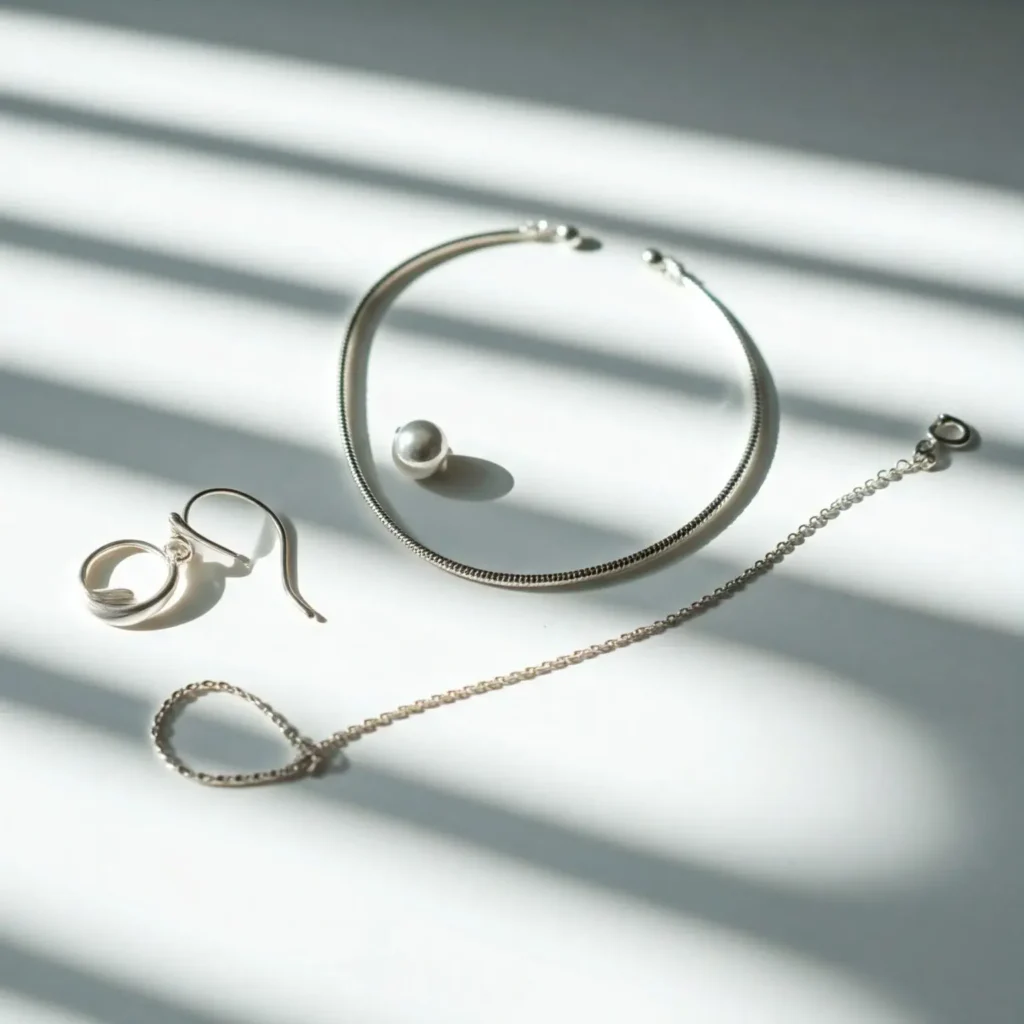 925 silver jewelry pieces on a light surface